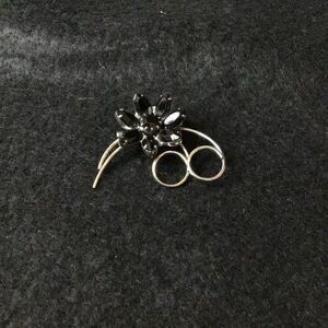 Vintage black rhinestone flower brooch